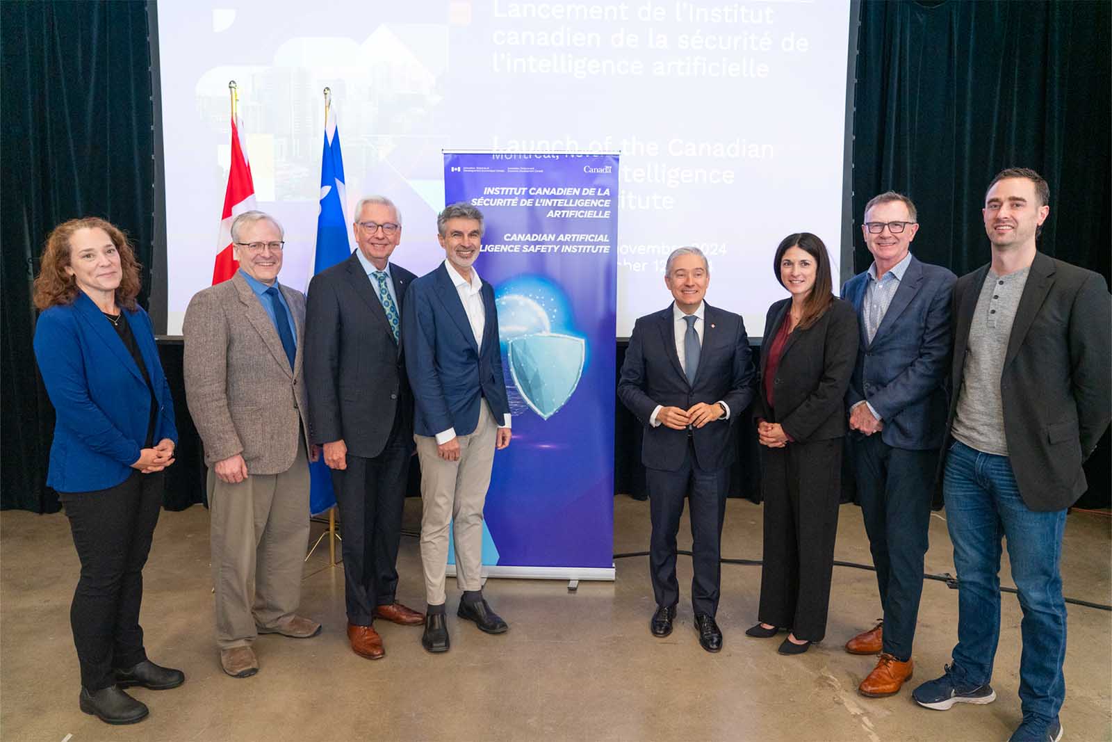 (L-R) Elissa Strome (CIFAR), Joel Martin (National Research Council Canada), Stephen Toope (CIFAR), Yoshua Bengio (Mila), François-Philippe Champagne (Government of Canada), Valérie Pisano (Mila), Tony Gaffney (Vector Institute) and Cam Linke (Amii) at the announcement of the Canadian AI Safety Institute in November 2024